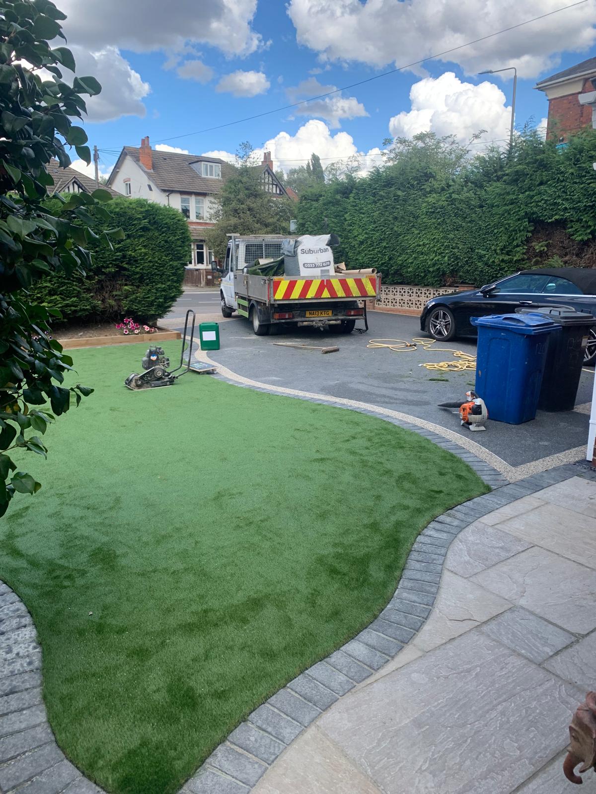 Front garden with new grass, block edging and a paved driveway